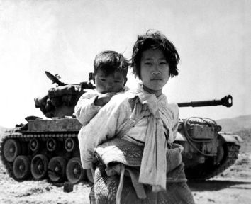 girl carries brother Corea war